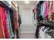 Organized walk-in closet with shelves and hanging racks filled with clothes and accessories at 7456 Hartsfield Dr, Lancaster, SC 29720