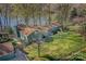 Aerial view of a lovely home with a well-maintained lawn and lake access at 7611 Buckland Rd, Charlotte, NC 28278