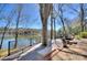 Beautiful lake view from a deck with black metal railings at 7611 Buckland Rd, Charlotte, NC 28278