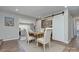 Cozy dining area with a wooden table, comfortable chairs, and stylish sliding pantry doors at 7611 Buckland Rd, Charlotte, NC 28278