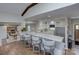 Stylish kitchen bar with granite countertops, modern stools, and open access to the kitchen at 7611 Buckland Rd, Charlotte, NC 28278