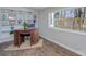 Home office with hardwood floors, built-in bookcase, and an outdoor view at 7611 Buckland Rd, Charlotte, NC 28278