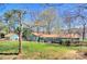 Back of house showing a nice yard and lake at 7611 Buckland Rd, Charlotte, NC 28278