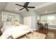 Spacious bedroom features hardwood floors, large windows and stylish furnishings at 7794 Live Oaks Dr, Denver, NC 28037