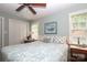 Cozy bedroom featuring a large bed, natural light, and closet space at 7794 Live Oaks Dr, Denver, NC 28037