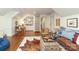 Finished bonus room with hardwood floors, built-in shelves, and an eclectic design at 7794 Live Oaks Dr, Denver, NC 28037