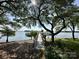 Picturesque view of a dock with a gazebo, set against a backdrop of serene waterfront scenery at 7794 Live Oaks Dr, Denver, NC 28037