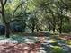 Tree-lined driveway creates a grand entrance to this estate at 7794 Live Oaks Dr, Denver, NC 28037