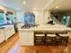Spacious kitchen featuring an island with marble countertop, seating, and premium appliances, ideal for culinary enthusiasts at 7794 Live Oaks Dr, Denver, NC 28037