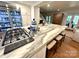 Bright kitchen featuring an island with marble countertop, seating, and premium appliances, ideal for culinary enthusiasts at 7794 Live Oaks Dr, Denver, NC 28037