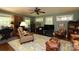 Inviting living room with hardwood floors, fireplace, neutral walls, and a ceiling fan at 7794 Live Oaks Dr, Denver, NC 28037