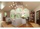 Bright living room featuring large windows, hardwood floors, and comfortable seating at 7794 Live Oaks Dr, Denver, NC 28037