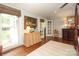 Bright main bedroom featuring hardwood floors and large windows with natural light at 7794 Live Oaks Dr, Denver, NC 28037