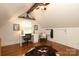Bright office space featuring hardwood floors, a desk, chair, and custom shelving with vintage touches at 7794 Live Oaks Dr, Denver, NC 28037