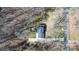 Aerial view of a single Gathering home with a long driveway and a fire pit at 8125 Appaloosa Ln, Charlotte, NC 28215