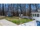 Spacious backyard featuring a shed, patio, and white picket fence at 8125 Appaloosa Ln, Charlotte, NC 28215