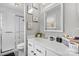 Clean bathroom featuring a shower, toilet, vanity, and a mirrored medicine cabinet at 8125 Appaloosa Ln, Charlotte, NC 28215