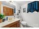 Bathroom featuring a marble countertop vanity and a patterned floor at 8125 Appaloosa Ln, Charlotte, NC 28215