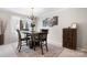 Bright dining room featuring a window and a chandelier at 8125 Appaloosa Ln, Charlotte, NC 28215