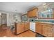 Kitchen with a breakfast nook, wood cabinets, and a breakfast bar at 8125 Appaloosa Ln, Charlotte, NC 28215