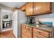 Kitchen featuring a side-by-side refrigerator and view into dining room at 8125 Appaloosa Ln, Charlotte, NC 28215
