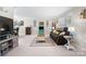 Cozy living room featuring neutral walls, plush seating, and natural light at 8125 Appaloosa Ln, Charlotte, NC 28215