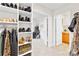 Walk-in closet with built-in shelves and hanging rods for optimal storage and organization at 963 Brookdale Ln, Stanley, NC 28164