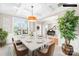 Spacious dining room featuring coffered ceilings, large windows, and elegant decor at 963 Brookdale Ln, Stanley, NC 28164
