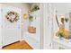 Foyer with hardwood floors, coat rack, and front door at 963 Brookdale Ln, Stanley, NC 28164
