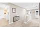 Upstairs hallway with carpet and railing featuring an overhead view of the laundry room at 963 Brookdale Ln, Stanley, NC 28164