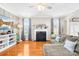 Spacious living room with a fireplace, hardwood floors, and comfortable seating at 963 Brookdale Ln, Stanley, NC 28164