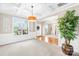 Open-concept living room featuring coffered ceilings, wainscoting, and large windows offering ample light at 963 Brookdale Ln, Stanley, NC 28164