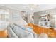 Spacious living room with hardwood floors and staircase access at 963 Brookdale Ln, Stanley, NC 28164