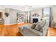 Inviting living room with a fireplace, hardwood floors, and comfortable sectional sofa at 963 Brookdale Ln, Stanley, NC 28164
