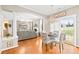 Open-concept living room with dining area, hardwood floors, and natural light at 963 Brookdale Ln, Stanley, NC 28164
