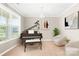 Bright office space featuring a piano, chandelier, and comfortable seating at 963 Brookdale Ln, Stanley, NC 28164