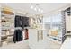 Spacious walk-in closet with custom shelving, storage, and a center island for organizing clothes at 963 Brookdale Ln, Stanley, NC 28164