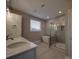 Bright bathroom featuring a double sink vanity, a soaking tub, and a glass-enclosed shower at 0000 Trull Hinson Rd # 2, Wingate, NC 28174