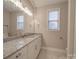 Neutral bathroom featuring a granite vanity, modern fixtures, and a decorative light fixture at 0000 Trull Hinson Rd # 2, Wingate, NC 28174