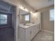 Spacious bathroom boasting double sinks with modern fixtures and a view of an adjacent bedroom at 0000 Trull Hinson Rd # 2, Wingate, NC 28174