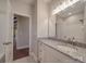 Neutral bathroom featuring a granite vanity, modern fixtures, and views of a room with hardwood flooring at 0000 Trull Hinson Rd # 2, Wingate, NC 28174