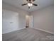 Comfortable bedroom featuring neutral walls, carpet, a ceiling fan, and closet with double doors at 0000 Trull Hinson Rd # 2, Wingate, NC 28174
