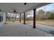 Expansive covered patio with sturdy wood columns and ample space for outdoor entertaining at 0000 Trull Hinson Rd # 2, Wingate, NC 28174