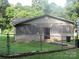 Angle view of a single story home with light siding, dark roof, and fenced yard, needs TLC at 1000 Jl Tyson Dr, Gastonia, NC 28056
