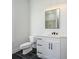 Bathroom featuring a white cabinet, quartz countertop, and black tile floor at 1022 Harrogate Dr, Bessemer City, NC 28016