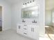 Bathroom with white cabinets, double sinks, quartz countertops, and a tile floor at 1022 Harrogate Dr, Bessemer City, NC 28016