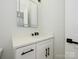 Bathroom featuring a single vanity sink with black hardware and an LED mirror at 1022 Harrogate Dr, Bessemer City, NC 28016