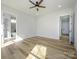 Bedroom with bright white walls, ceiling fan, and light hardwood floors at 1022 Harrogate Dr, Bessemer City, NC 28016