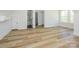 Large bedroom with hardwood floors, a bathroom and closet entrances, and a scenic window at 1022 Harrogate Dr, Bessemer City, NC 28016