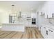 Bright, open kitchen with white cabinets, marble countertops, and stainless steel appliances at 1022 Harrogate Dr, Bessemer City, NC 28016